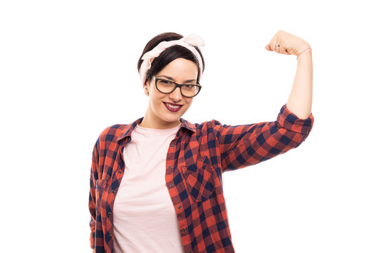 Pretty pin-up girl wearing glasses showing her biceps.
