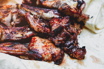 juicy pieces of barbeque shish kebab on thin bread