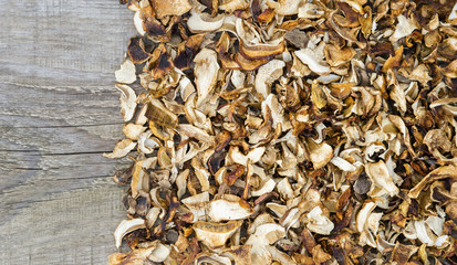 Dried boletus isolated on old wooden background, selective focus, close-up shot