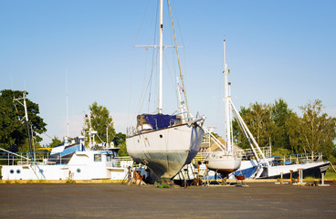 Fototapeta premium Old and broken boat in repair