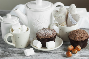 Chocolate cupcakes, marshmallow and different Christmas decorations