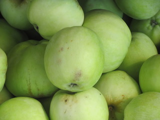 Green apples in a close-up box