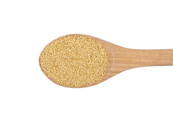 Amaranth seeds in wooden spoon isolated on white background, top view