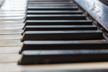 Closeup of old piano keyboard shallow focus