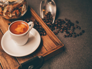 Close up hot coffee on wooden background.