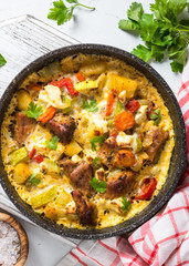 Frittata with meat and vegetables top view.