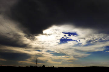the lake is almost evening. cloud, here it will rain. can see the power line in the distance