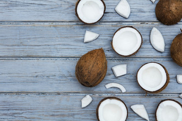 Coconuts on a rustic wooden background.