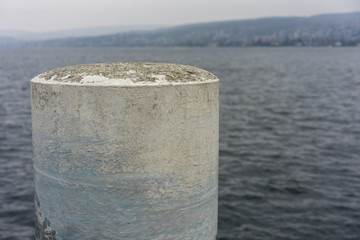 Naklejka premium massive stone pole in water