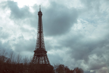 Eiffel tower against the cloudy sky, rain clouds, drama, autumn