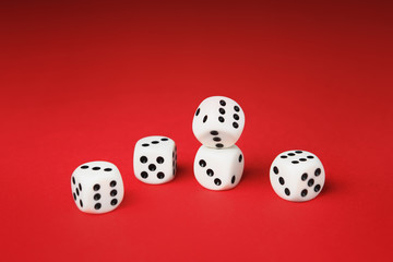 White dice on red background. Board game concept.