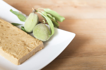 Spanish almond nougat on wooden table (sweet christmas)