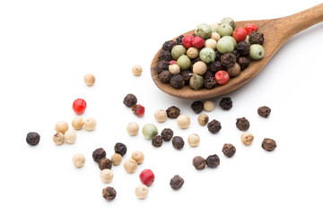 Pepper mix seed on spoon on white background.