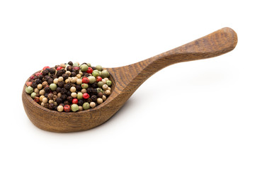 Pepper mix seed on spoon on white background.