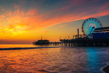 Visitors enjoy sunset above Santa Monica Pier in Los Angeles - obrazy, fototapety, plakaty