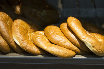 A lot of small bread in the store.