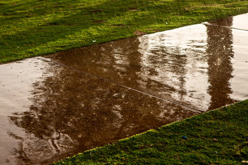 Heavy rain hitting a footpath and splashing at Mannum South Australia on 6th August 2018