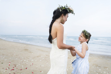Fototapeta na wymiar Beautiful bride with her flower girl