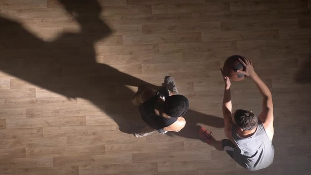 Topshot, referee giving basketball to player, two opposing players trying to take ball