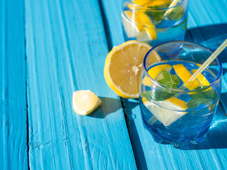 Refreshing lemonade in glass glasses on the table