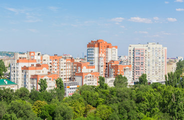 Obraz premium Urban landscape from a height of 12 floors. Modern architecture, multi-storey residential buildings. City Of Saratov, Russia.