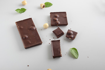 chocolate bar with hazelnut on a light background