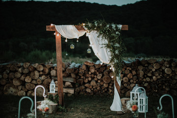 Wedding arch with garlands and other decorations