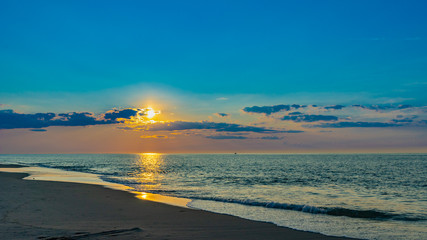 Sunset on the beach on north side of the Provincelands Cape Cod, Atlantic ocean view MA US.