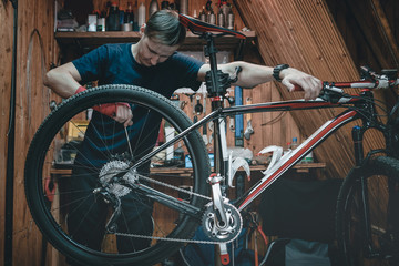 Fototapeta na wymiar bicycle mechanic. repairing.