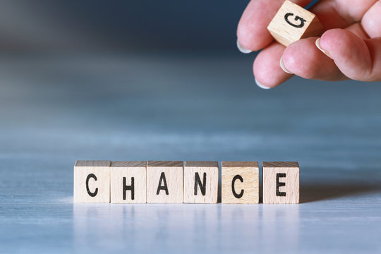 Hand after changing letter g to c, changing the word change to chance
