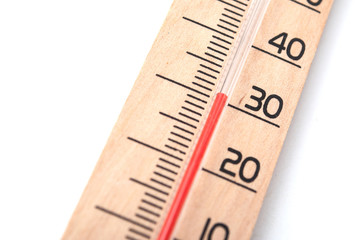 closeup of wooden thermometer on white background