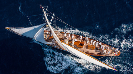 French Riviera - old sail race straight above aerial view sunset