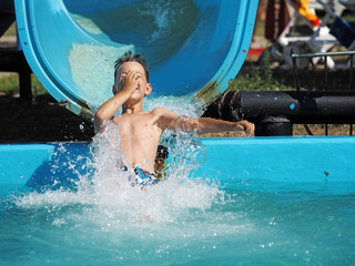 Little boy playing in a water park