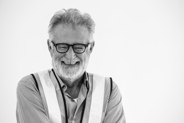 Portrait of smiling happy senior engineer worker man on white background