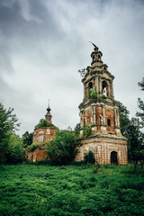 Fototapeta na wymiar Abandoned and ruined ancient Orthodox Russian Church with tower