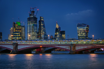 Blackfriars Bridge and the City of London at night in August 2018