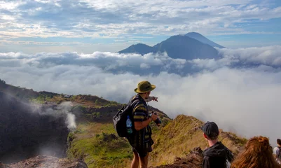 Fotobehang Bali island,Batur volcano,Indonesia / 21 jul 2018 : Tourist show the way to  Batur volcano view point,sunrise time © Glebstock