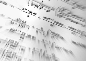 Large number of mathematical formulas focus on a white background