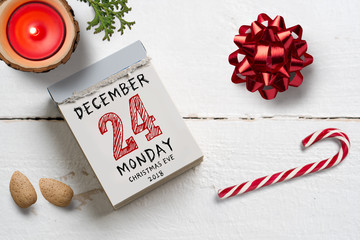 tear off calendar with 24th of december 2018, christmas eve on top