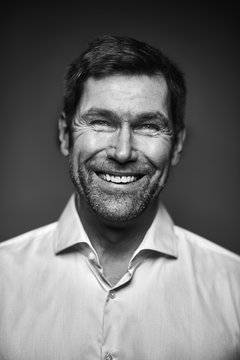 Portrait of smiling man, black and white