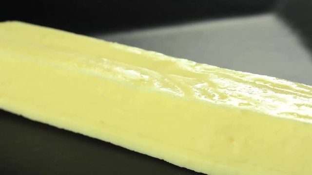 Pouring honey in traditional Brazilian curd cheese called queijo coalho  1