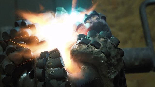 Welder welds the parts of the metal structure. Manufacture of drills for drilling rig. Welding is an integral part of the technological process.