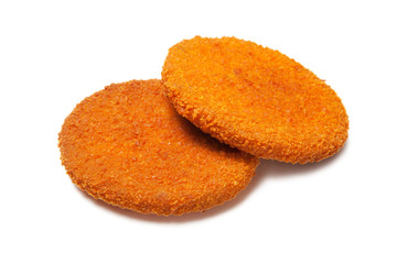 Two fried hamburger breading fish patties isolated on white background