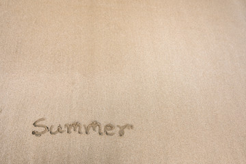 Fototapeta na wymiar Summer Text message in sand on the beach
