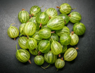 Berries of gooseberries on a dark background.