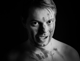 Man with total black eyes.