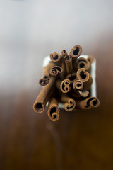 Cinnamon sticks on wooden blur background