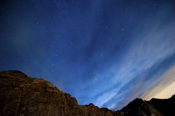 Obraz na płótnie Canvas night view with stars and blue sky over the mountains