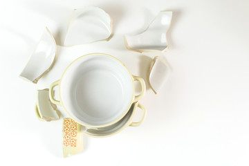 Broken and whole plate on a light background.