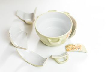 Broken and whole plate on a light background.